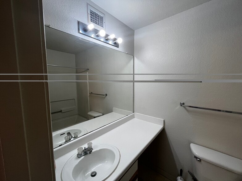 Bathroom sink & mirror - 521 Southwest Pky