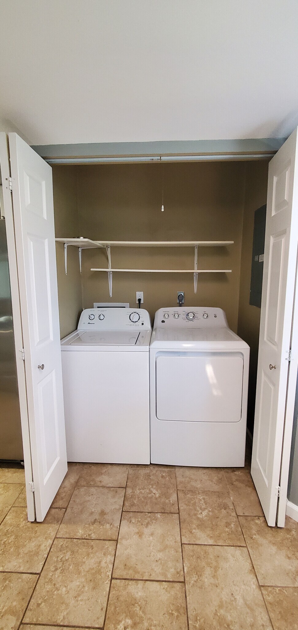 Laundry closet with shelving - 313 Britanna Dr