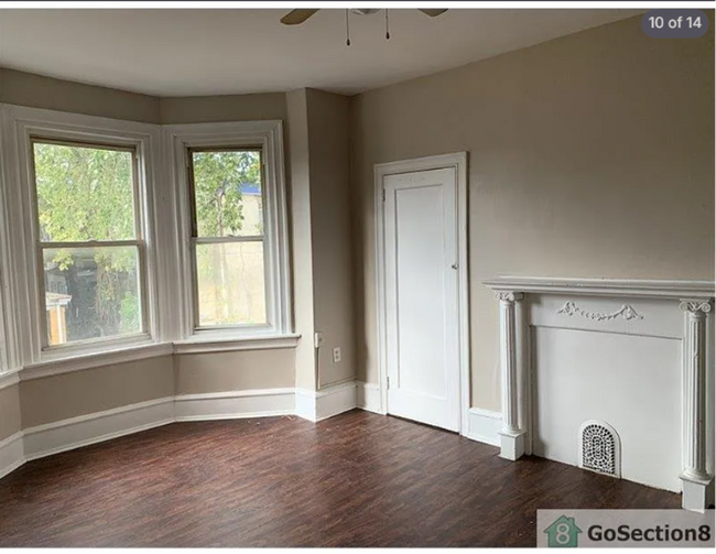 Building Photo - Spacious 3BR Townhouse with Modern Kitchen  Hardwood Floors  Available Now!