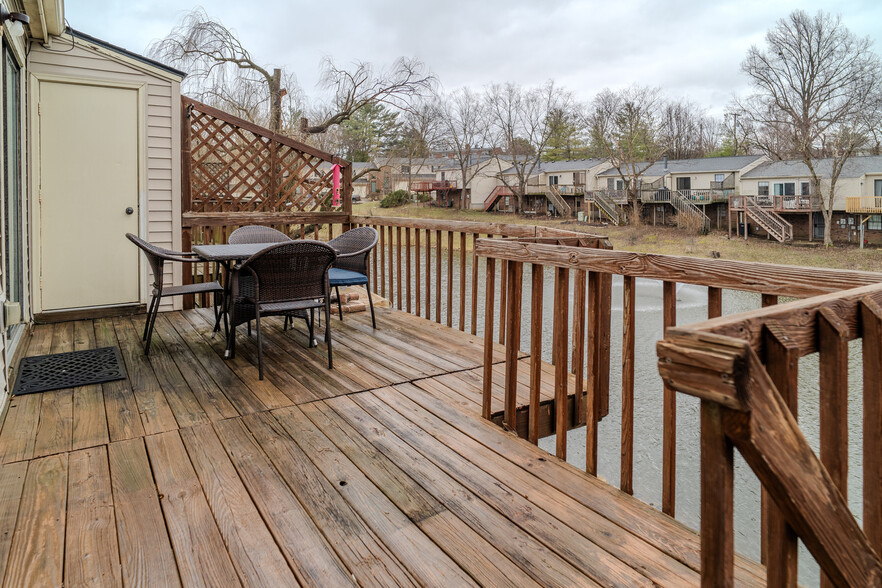 Deck with view of pond behind. - 3408 Springlake Dr