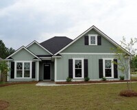 Building Photo - Spacious 4BR Home with Open Split Floor Plan, Granite Kitchen & Fenced Yard
