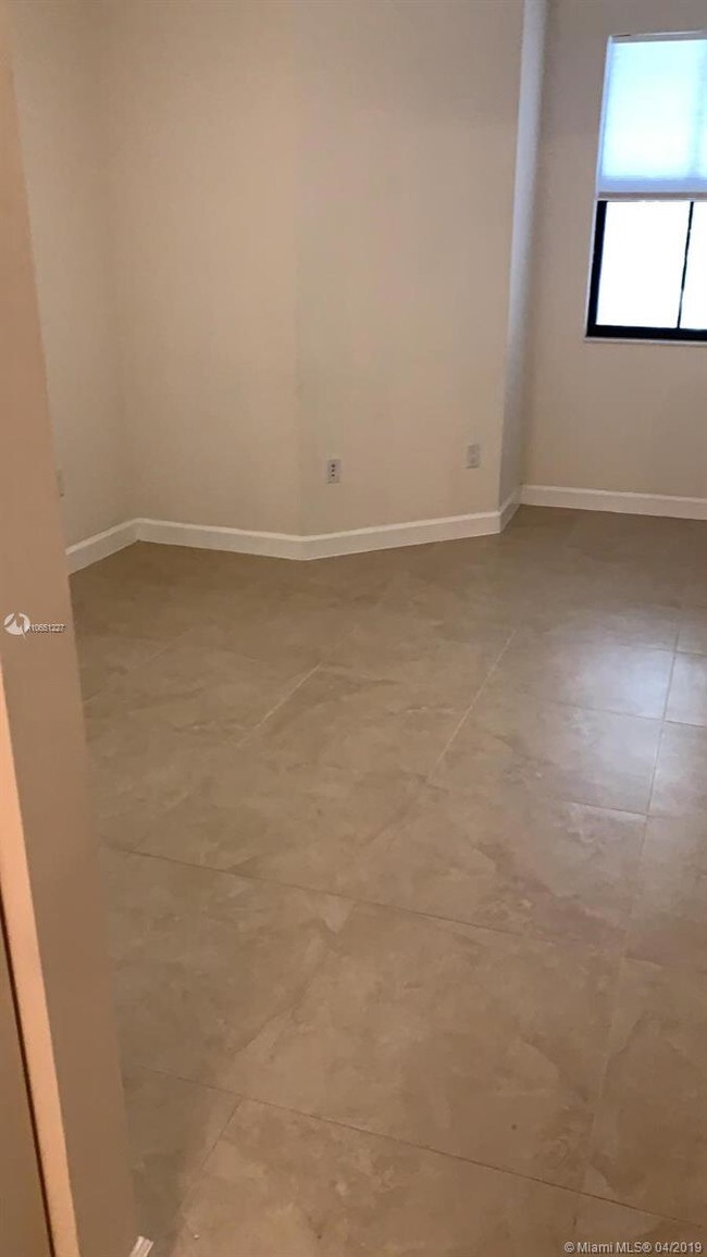 Building Photo - 6175 NW 104th Ct