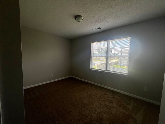 Building Photo - This property features 2 bedrooms and 2.5 bathrooms. Conveniently located near shopping centers, ...