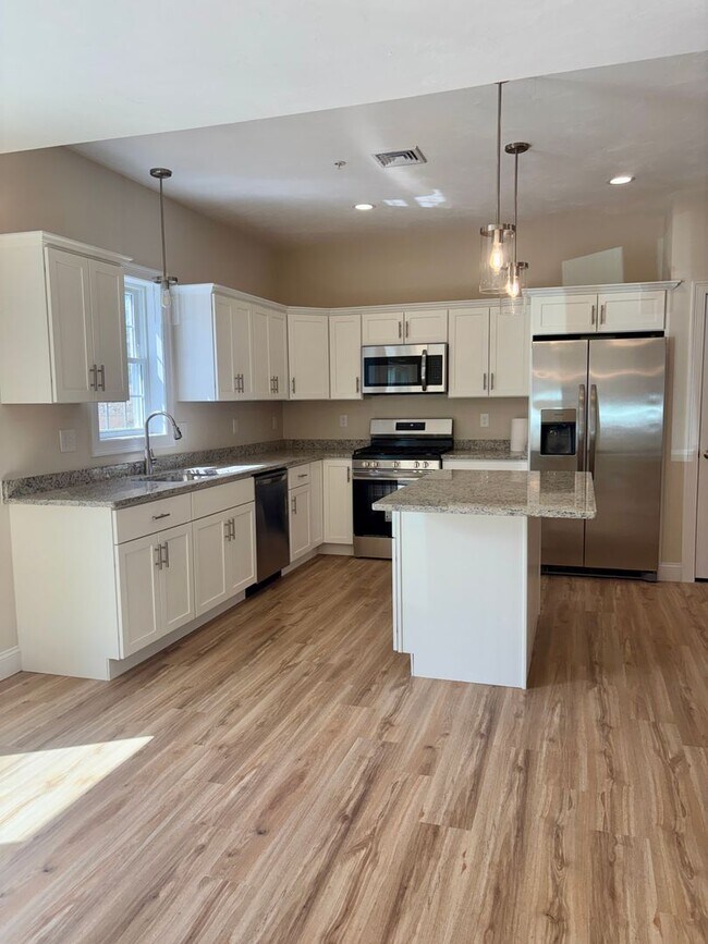 Building Photo - Brand New Townhouse-Style Living with Modern Finishes