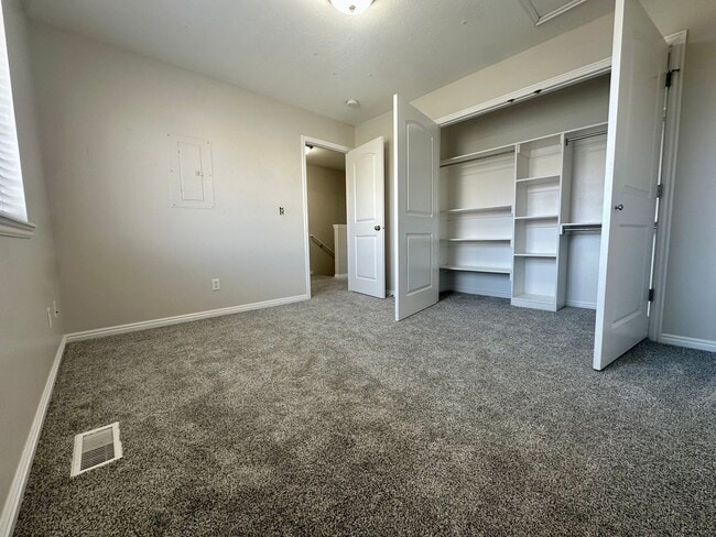 Building Photo - 2-Bedroom Townhome with Central AC and Covered Parking