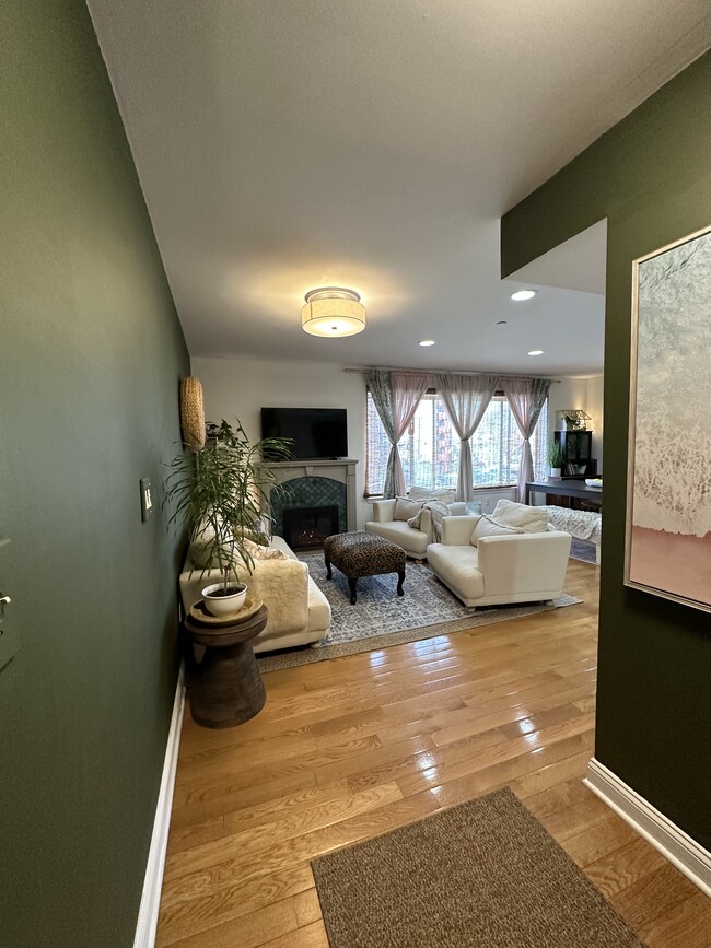 Living Room w/ electric fireplace - 7420 Boulevard East