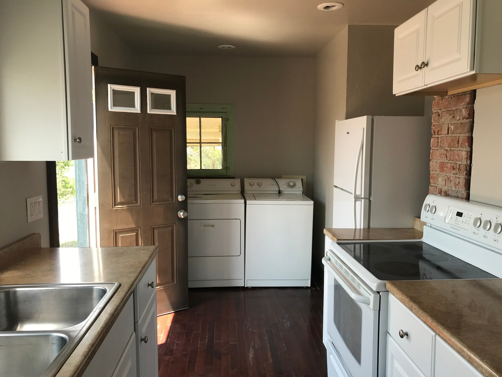 Washer and dryer in the kitchen - 1105 E 8th St