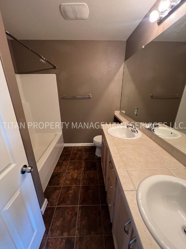 Building Photo - Beautiful Three Story Townhouse with Gas Fireplace, Balcony & 2-Car Garage