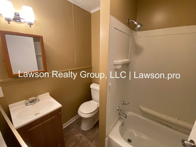 Building Photo - Updated Three Bedroom with Flat Yard