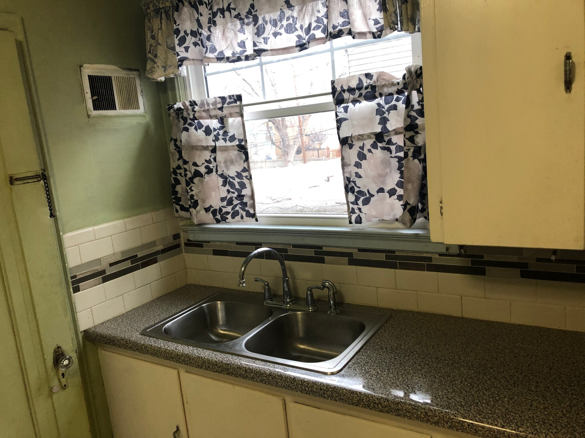 Kitchen/New window/ new curtains - 3536 N 47th Ave