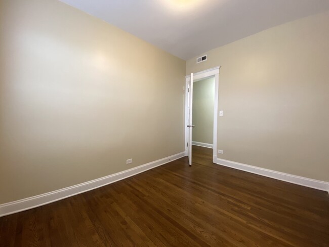 Bedroom with hardwood floors - 3156 W Diversey