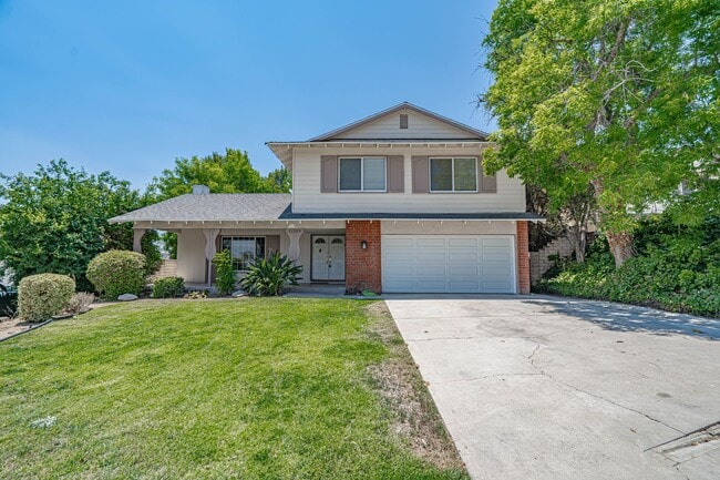 Primary Photo - Spacious 4-Bedroom Home with Sun Room & Vi...