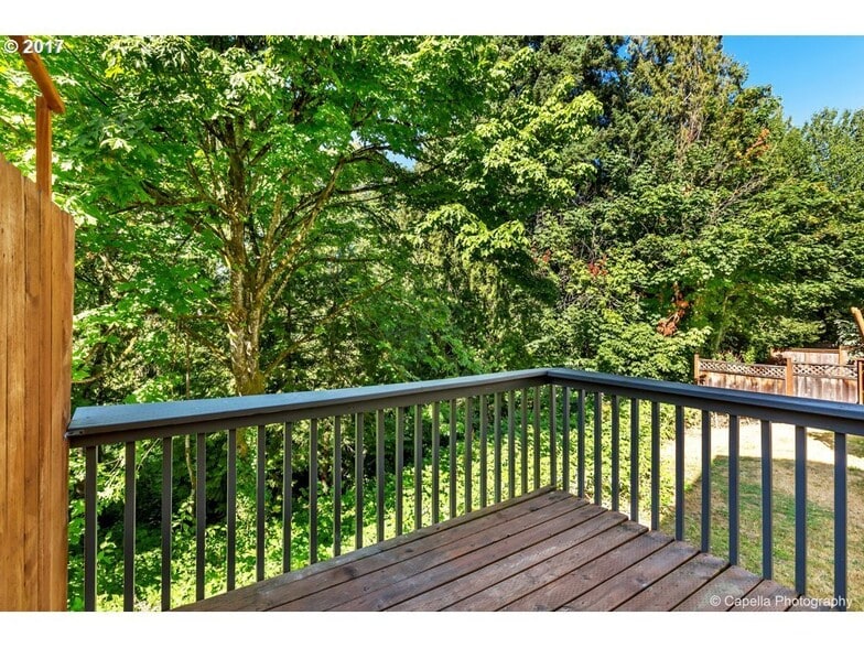 Private deck overlooking a beautiful green space and a running creek - 7414 NE Shaleen St