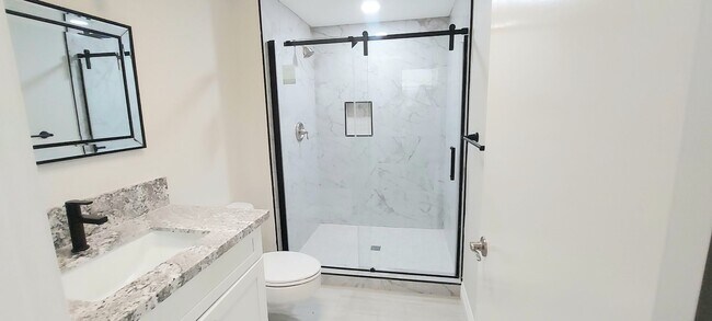 Building Photo - * UTILITIES INCLUDED * TOTALLY REMODELED 2X2
