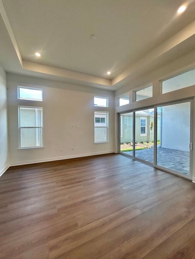 Building Photo - Gorgeous 4/3 Residence with a Private Back Lanai and a 3 Car Garage in the Delightful Laureate Pa...