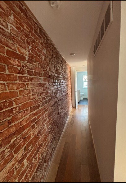 Exposed Brick hallway upstairs - 155 Sheldon Ln