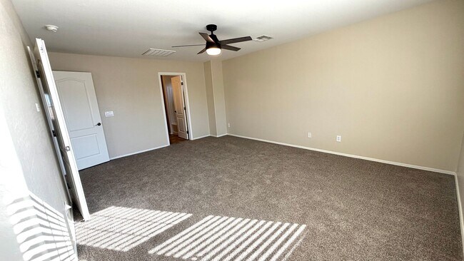 Building Photo - Spacious Surprise home with large backyard