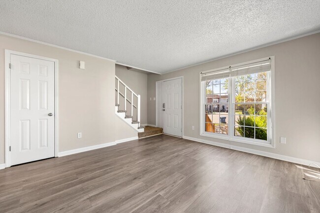 Building Photo - Introducing a Charming End Unit Townhouse ...
