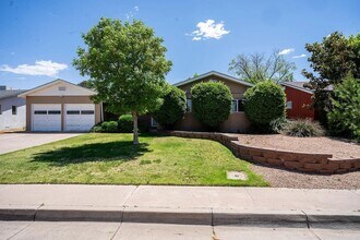 Building Photo - Spacious 4 Bedroom 2 Bathroom Home In The NE Heights!
