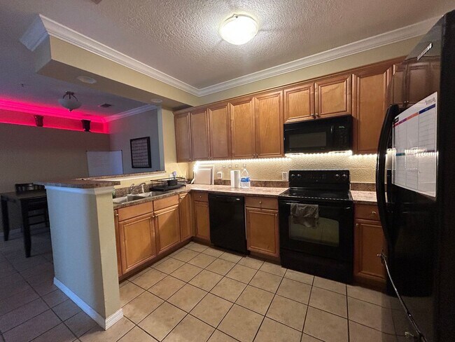 Building Photo - Walk to UF! Spacious & Furnished 3BD Condo...