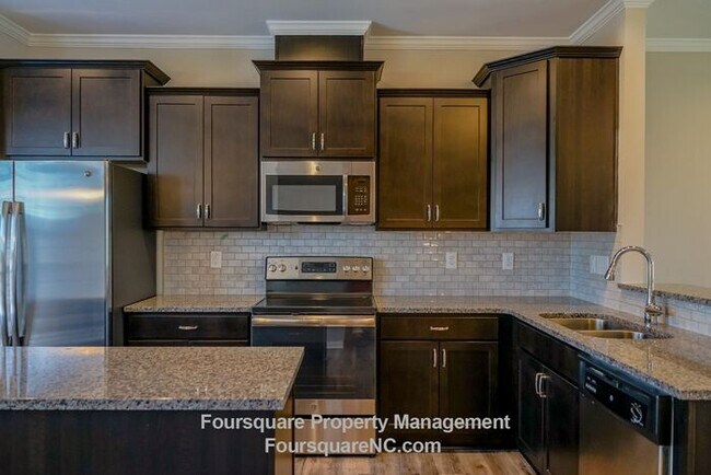 Building Photo - Modern 3-Story Townhome with Entry-Level Bonus Room, Back Deck & Garage , Community Pool in North...