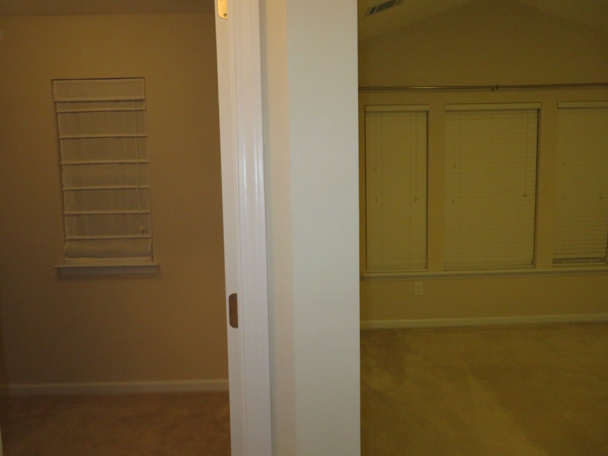 Master Suite - Closet/Dressing Room on left at the entrance w Roman blind, Bedroom on right w blinds - 2496 Stadium Dr