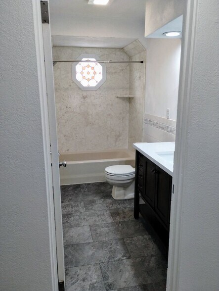 Bathroom has new flooring & vanity - 246 Brackett St