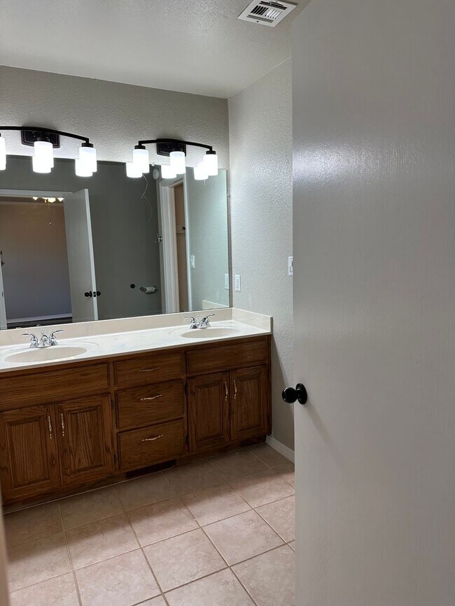 Building Photo - Clean, updated home on a corner lot with privacy fence and storage shed.