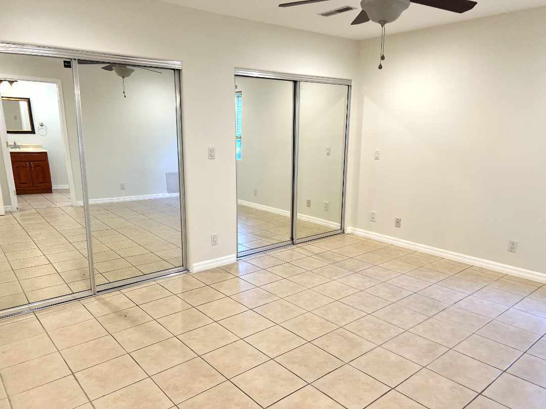 Primary bedroom with dual closets. - 2330 S Mansfield Ave