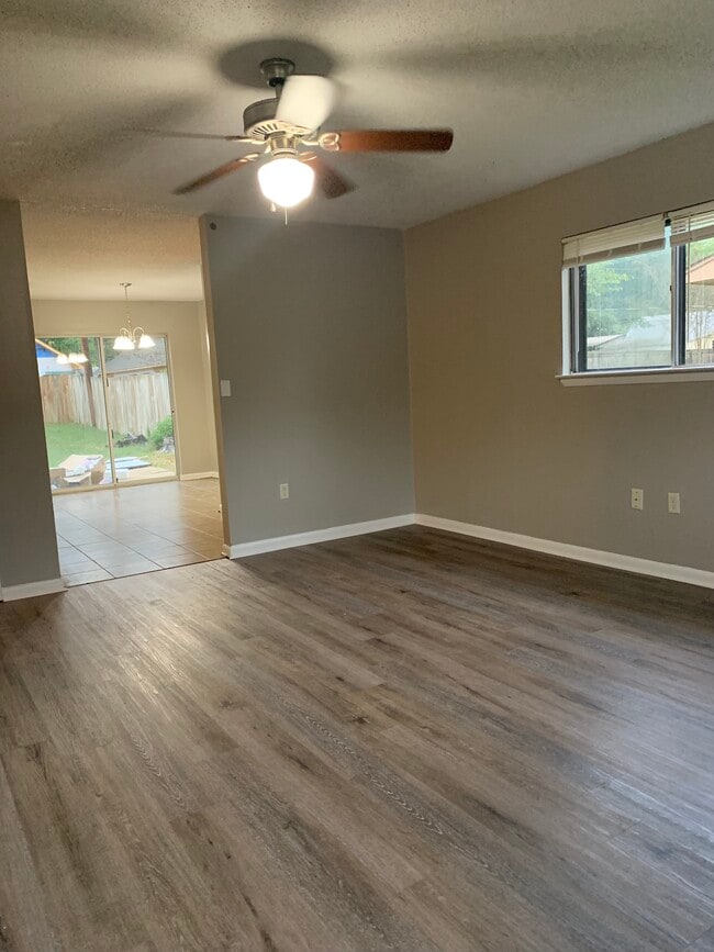 Living room - All new LVP flooring throughout house as well as fresh paint. - 203 Club Ln