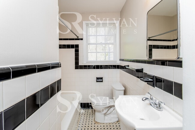 Building Photo - The living is easy in this 3 bedroom, 2 bathroom brick home