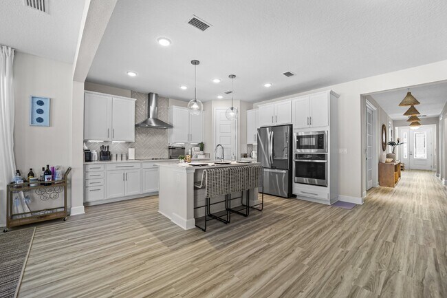 Building Photo - "Luxurious Furnished Home with 4-Bed, 3-Bath, Swim Spa Fenced Yard Golf Cart steps to the beach!"