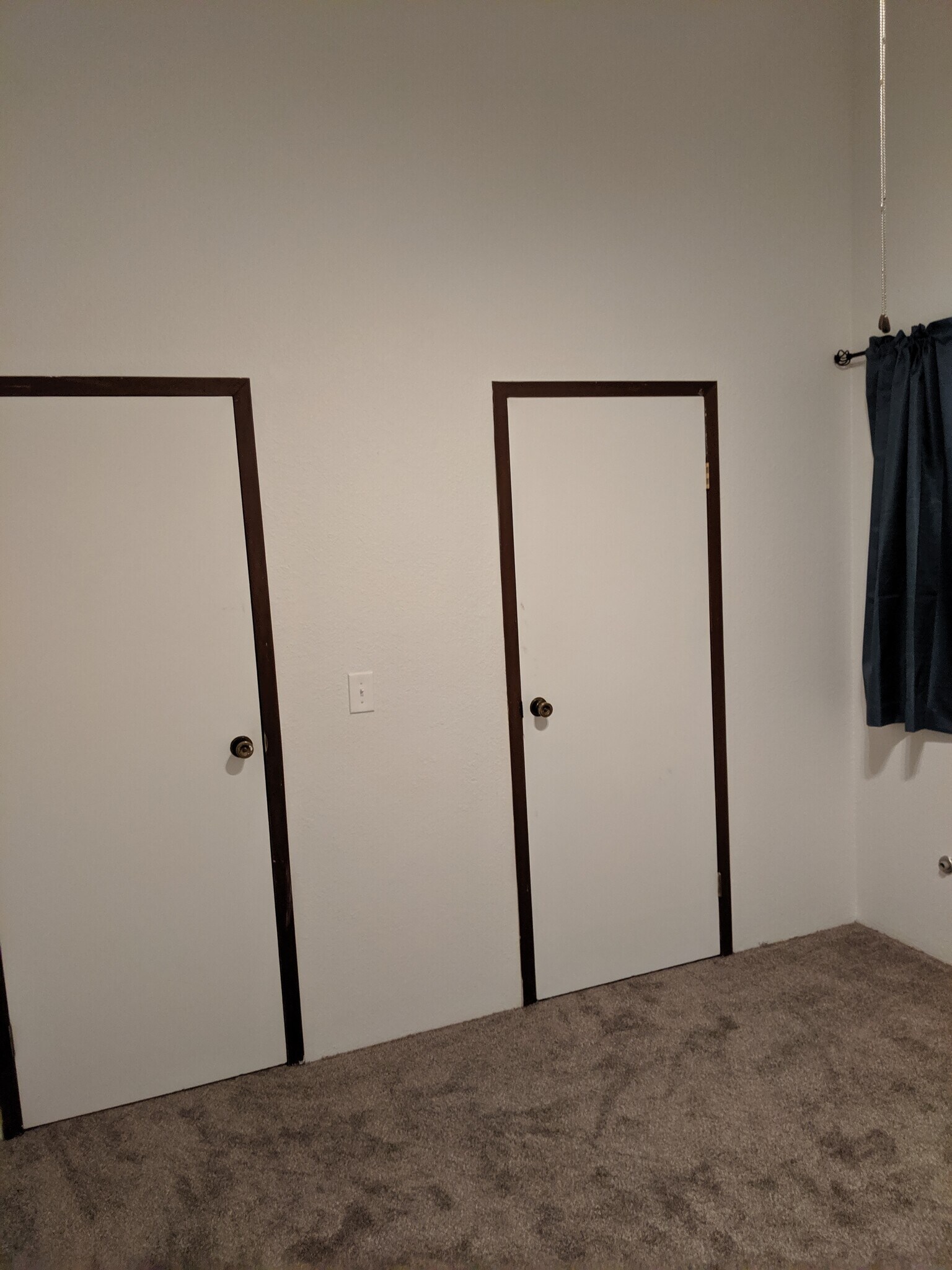 Bedroom 2 looking at the door to the landing and the door to the walk in closet. - 2115 Pleasanton St