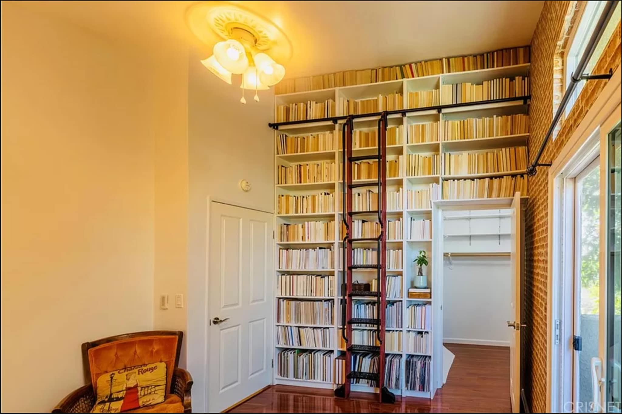 Front bedroom. Plenty of shelves for books and other items. Large walk in closet. - 1554 N Hobart Blvd