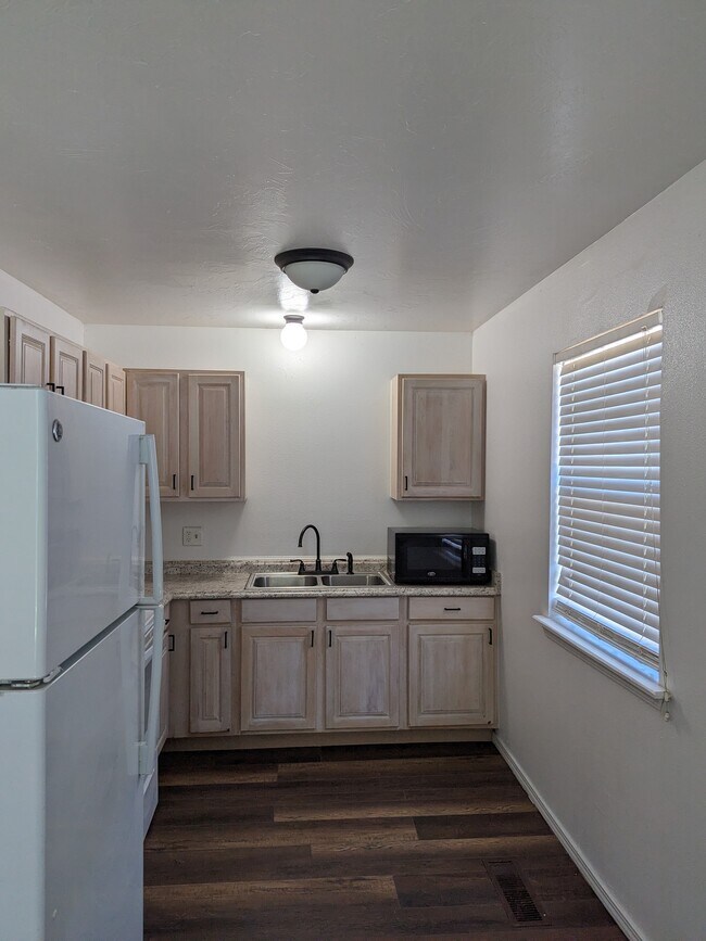 Kitchen with new cabinets - 304 Vicksburg Cir