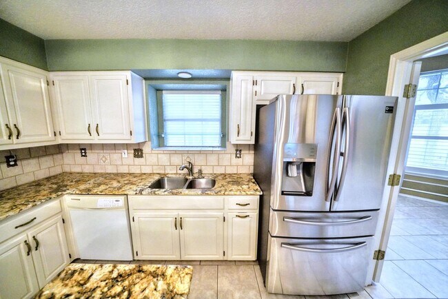 Building Photo - Executive Home in Greenshire with Luxurious Updates and Spacious Outdoor Living - Agent Commissio...