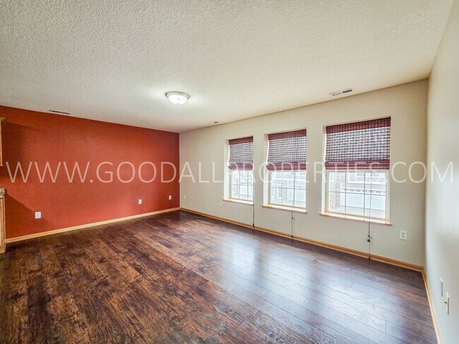 Building Photo - Bright & Spacious Waukee Townhome Near Dining, Shopping & Entertainment and attached 2-car garage