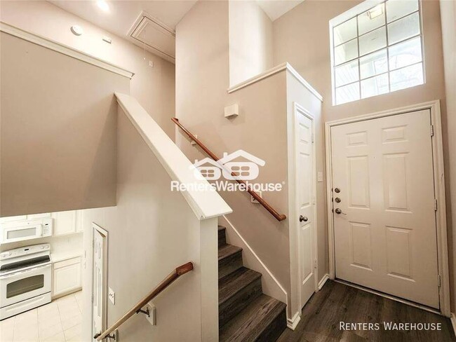 Building Photo - This gem of a townhome is nestled in the w...