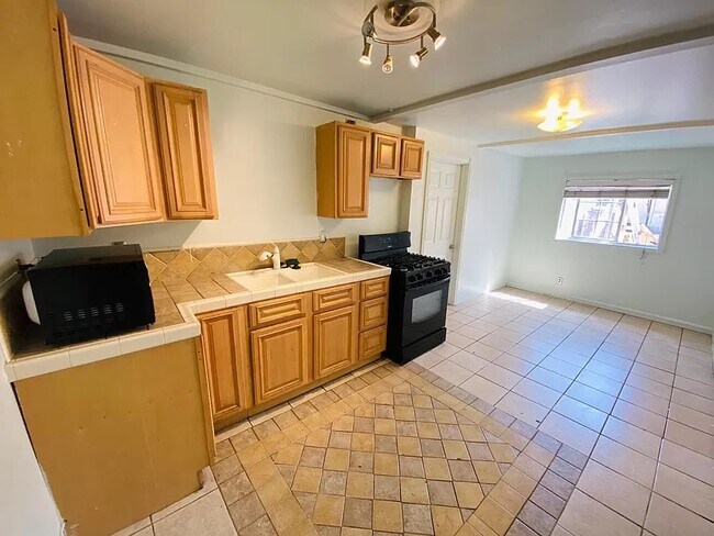 Kitchen + living room - 1016 E Ross Ave