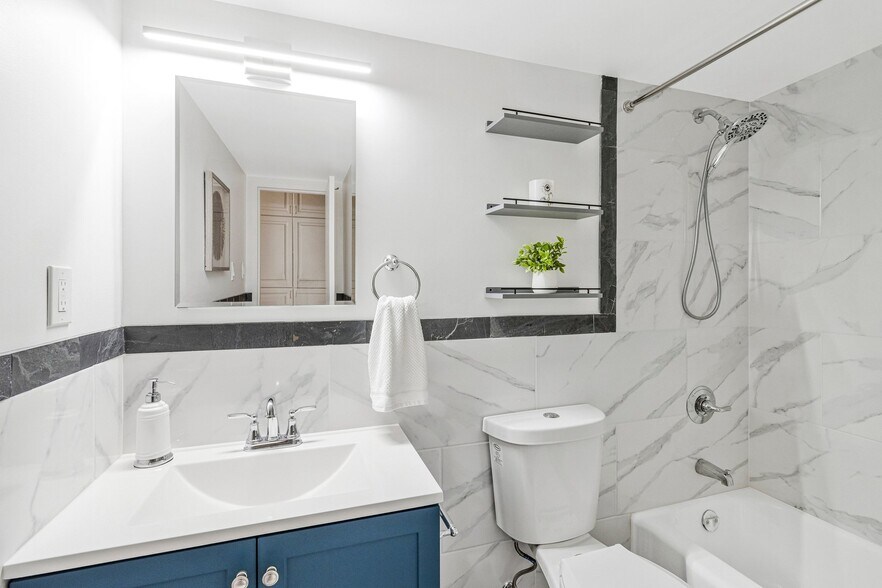Both bathrooms updated with similar decor - 2939 Van Ness St NW