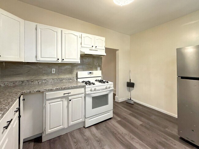 Building Photo - Charming Baltimore Rowhome with Updated Kitchen, Covered Front Porch & Basement