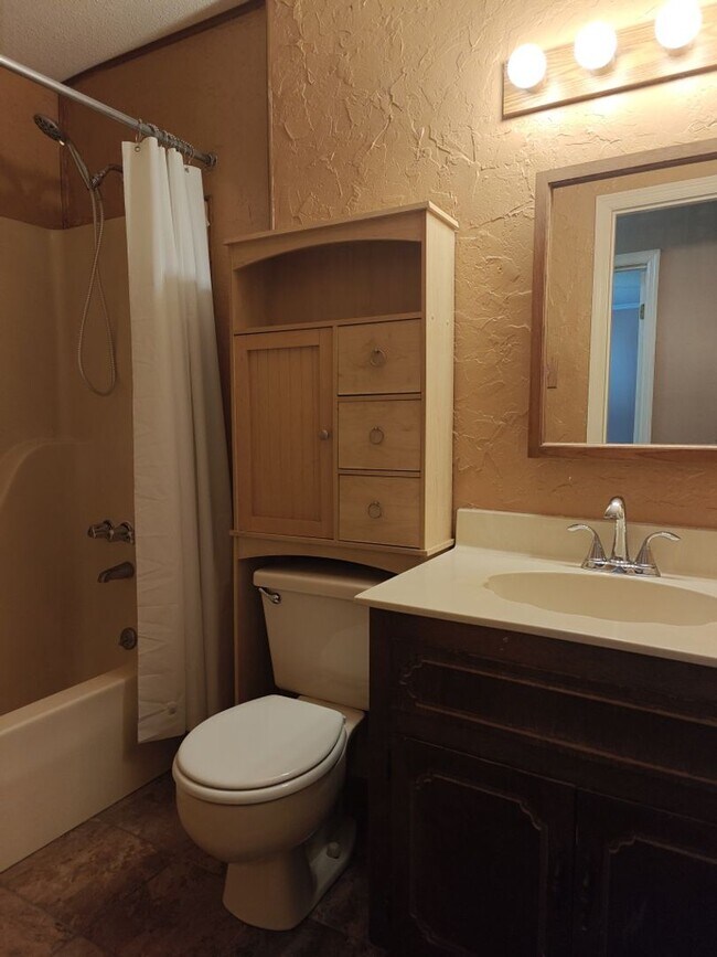 Building Photo - Elegant & Spacious 3-Bedroom Brick Home with Private Garage