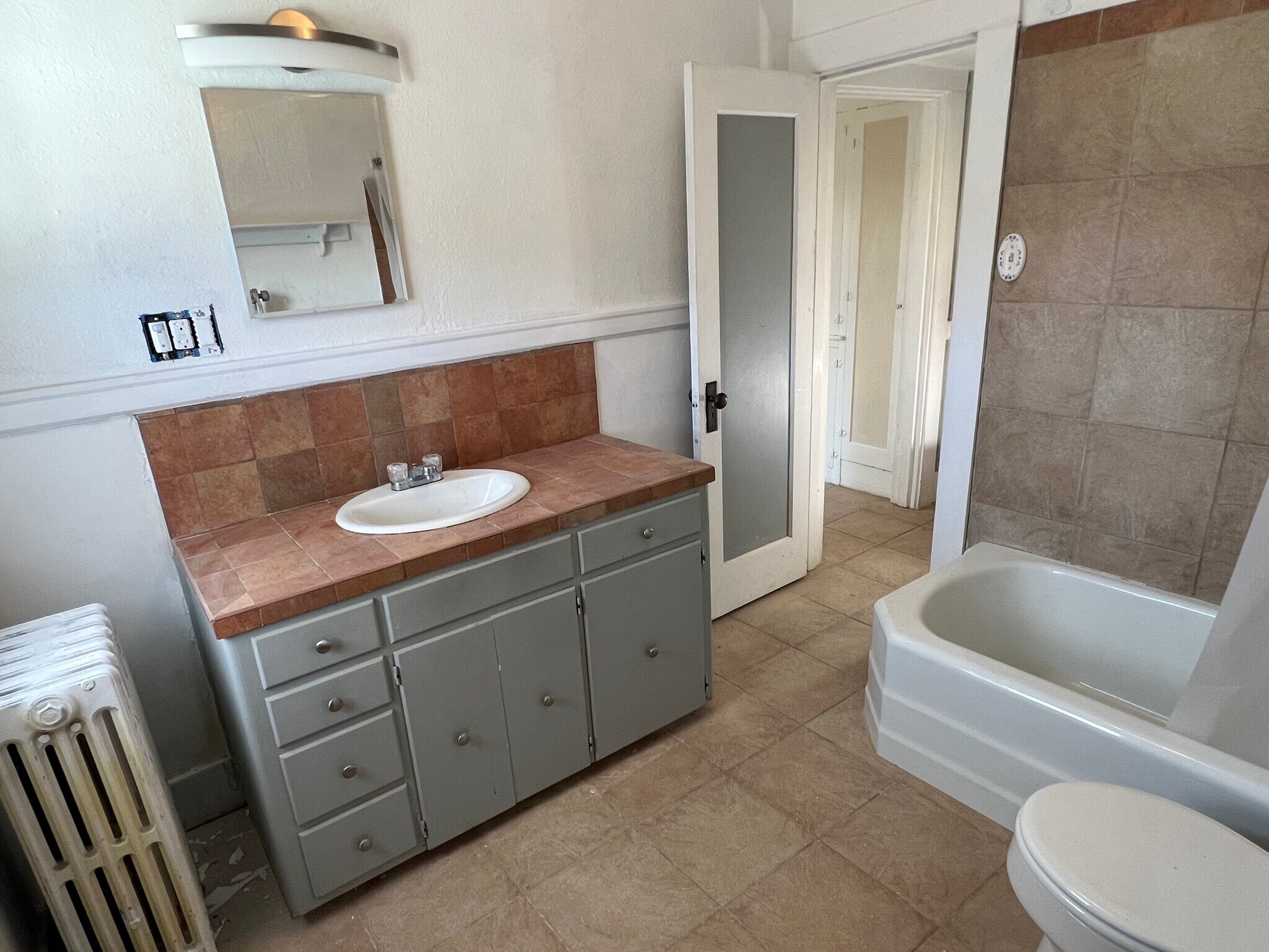 Tiled Bathroom with tub & shower - 412 John Adams St