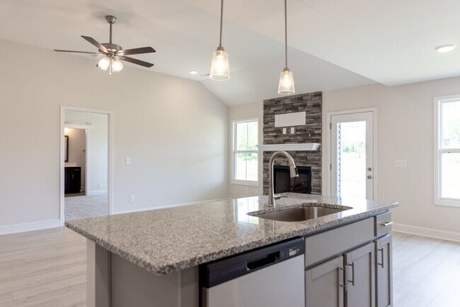 Building Photo - Modern Living Redefined with Stone Fireplace, Gray Cabinetry, Spa Inspired Primary Suite and Cove...