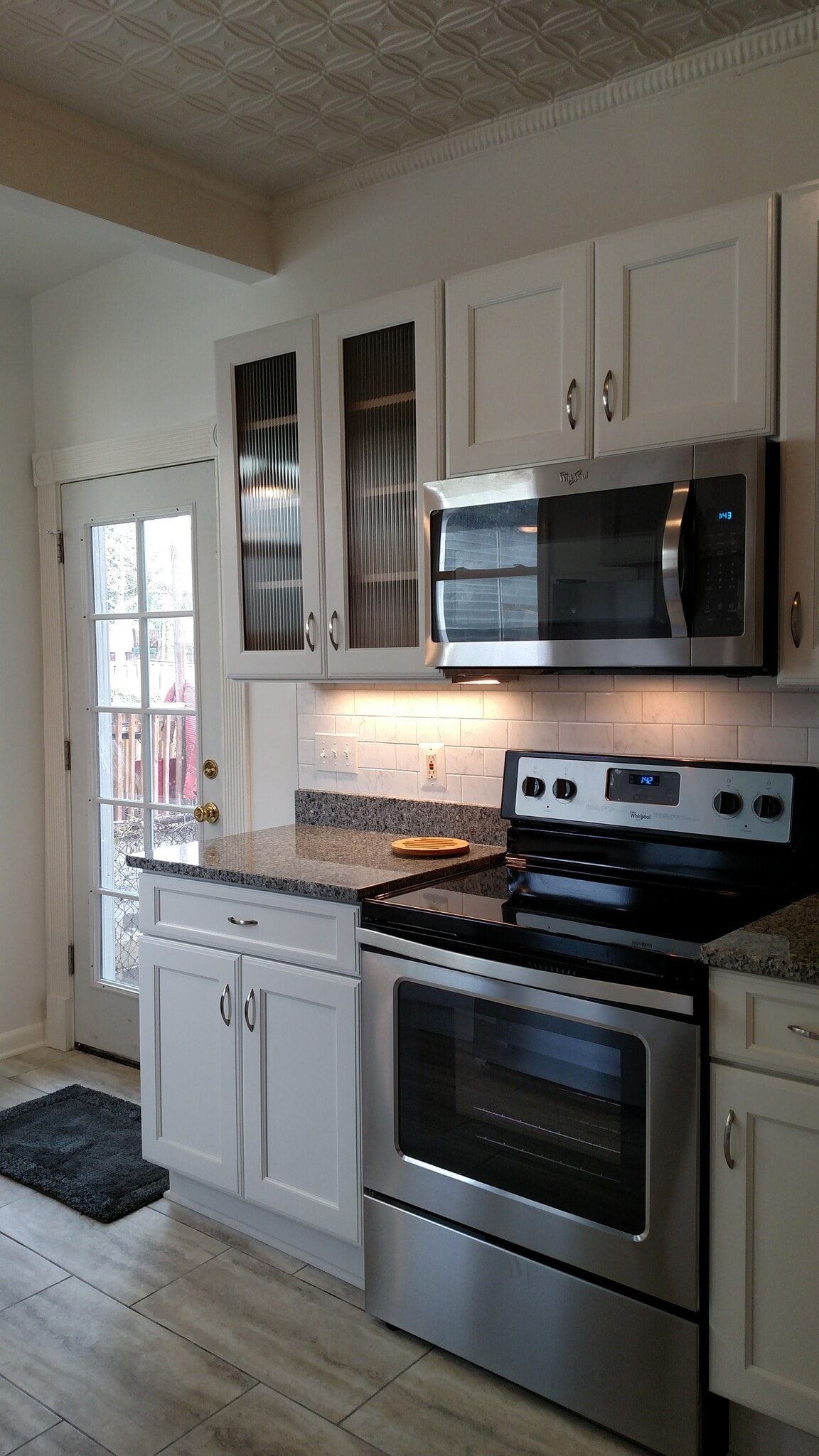 Recently renovated kitchen. Door is to backyard. - 2509 10th St NE