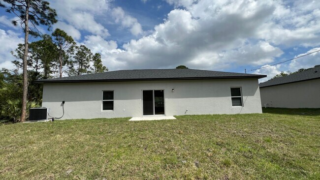 Building Photo - Smart & Stylish 3BD/2BA Palm Bay Home – Modern Upgrades, No Water Bills!