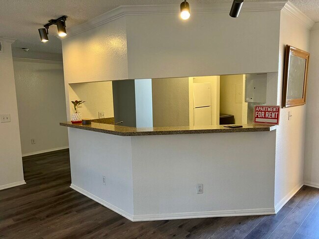 Living room view to kitchen - 10655 Lemon Ave