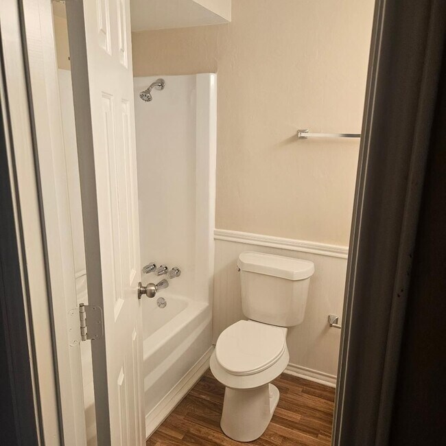 Building Photo - Three bedroom and two bathroom nicely remodeled with new flooring. Large wood fenced backyard