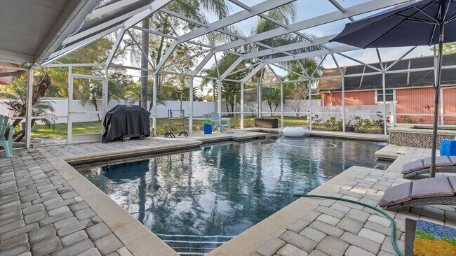 Building Photo - Luxurious FURNISHED 4BR/3BA Pool Home with...