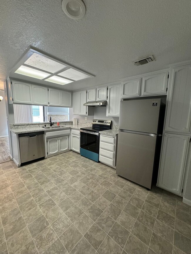 Building Photo - Remodeled 2-Bed, 2-Bath Condo for Rent Nea...